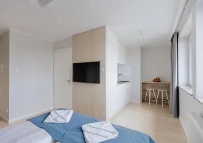 Łóżko lub łóżka w pokoju w obiekcie Q19 Apartments Rynek