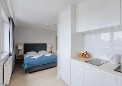 Łóżko lub łóżka w pokoju w obiekcie Q19 Apartments Rynek