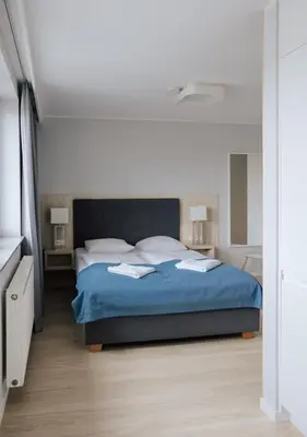 Łóżko lub łóżka w pokoju w obiekcie Q19 Apartments Rynek
