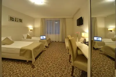 Telewizja i/lub zestaw kina domowego w obiekcie Hotel Camelot