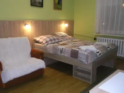 Łóżko lub łóżka w pokoju w obiekcie Góściniec Iwona