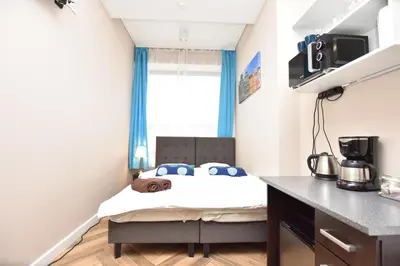 Łóżko lub łóżka w pokoju w obiekcie DUKES Apartments - Wita Stwosza