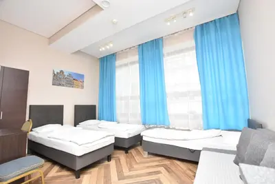 Łóżko lub łóżka w pokoju w obiekcie DUKES Apartments - Wita Stwosza