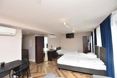 Łóżko lub łóżka w pokoju w obiekcie DUKES Apartments - Wita Stwosza