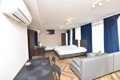Łóżko lub łóżka w pokoju w obiekcie DUKES Apartments - Wita Stwosza