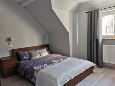 Łóżko lub łóżka w pokoju w obiekcie Apartament Z Widokiem