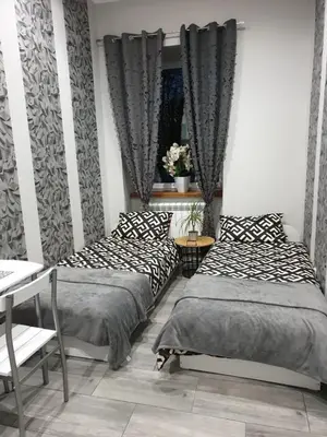 Łóżko lub łóżka w pokoju w obiekcie Sanktuarium Snu Apartments