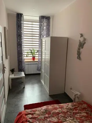 Łóżko lub łóżka w pokoju w obiekcie Sanktuarium Snu Apartments