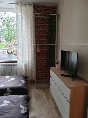 Telewizja i/lub zestaw kina domowego w obiekcie Sanktuarium Snu Apartments