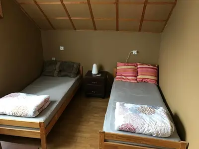 Łóżko lub łóżka w pokoju w obiekcie Nad Sowiogorskim Potokiem