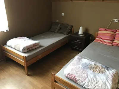 Łóżko lub łóżka w pokoju w obiekcie Nad Sowiogorskim Potokiem