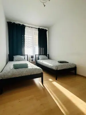 Łóżko lub łóżka w pokoju w obiekcie Apartament Słoneczny 3