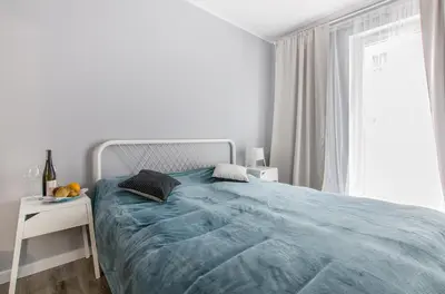 Łóżko lub łóżka w pokoju w obiekcie Smart Rental Management Apartments - CITY CENTER
