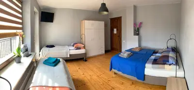 Łóżko lub łóżka w pokoju w obiekcie Po drodze