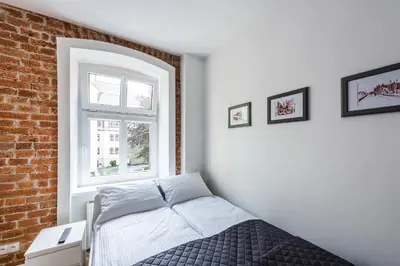Łóżko lub łóżka w pokoju w obiekcie Apartament SWEET TIME