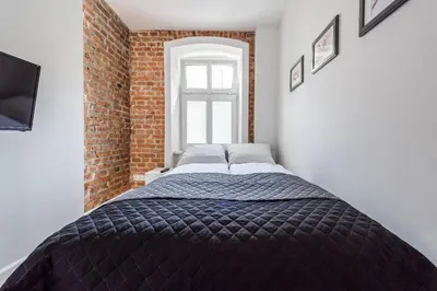 Łóżko lub łóżka w pokoju w obiekcie Apartament SWEET TIME