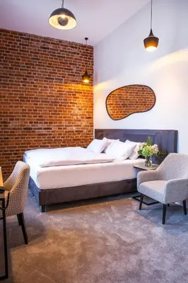 Łóżko lub łóżka w pokoju w obiekcie Hotel Hugo Business & Spa