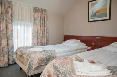 Łóżko lub łóżka w pokoju w obiekcie Hotel Hugo Business & Spa