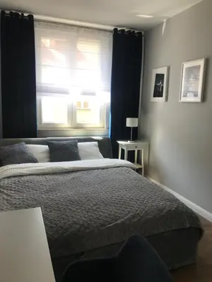 Łóżko lub łóżka w pokoju w obiekcie Apartament w samym sercu Opola