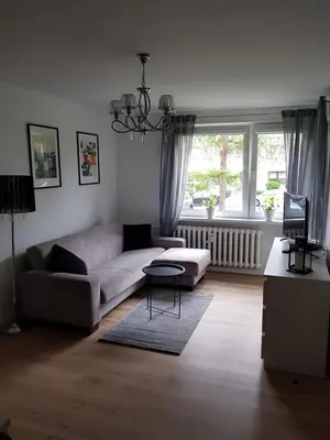 Łóżko lub łóżka w pokoju w obiekcie Apartament Okrzei