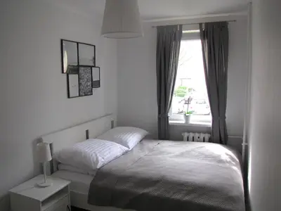 Łóżko lub łóżka w pokoju w obiekcie Apartament Okrzei