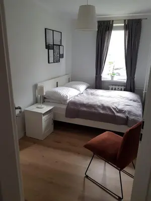 Łóżko lub łóżka w pokoju w obiekcie Apartament Okrzei