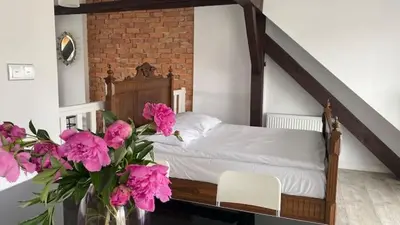 Łóżko lub łóżka w pokoju w obiekcie Villa Cuprum