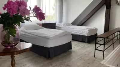 Łóżko lub łóżka w pokoju w obiekcie Villa Cuprum