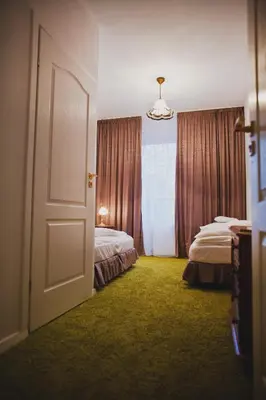 Łóżko lub łóżka w pokoju w obiekcie Villa Cuprum