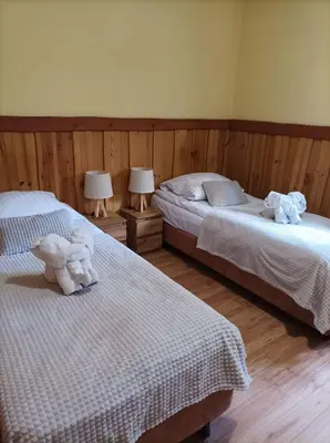 Łóżko lub łóżka w pokoju w obiekcie Karczma Michelle