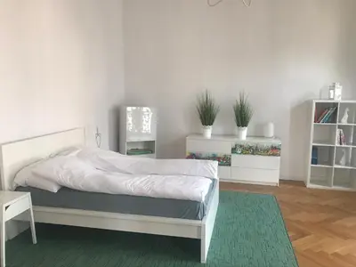 Łóżko lub łóżka w pokoju w obiekcie Nokturn Apartament