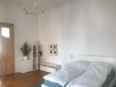 Łóżko lub łóżka w pokoju w obiekcie Nokturn Apartament