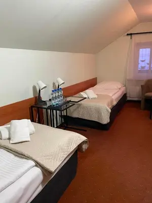 Łóżko lub łóżka w pokoju w obiekcie Hotel SONATA