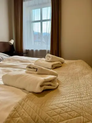 Łóżko lub łóżka w pokoju w obiekcie Hotel SONATA
