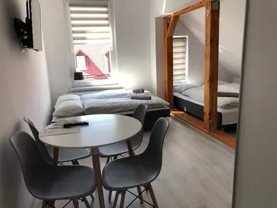 Łóżko lub łóżka w pokoju w obiekcie Apartament przy Parku Zdrojowym