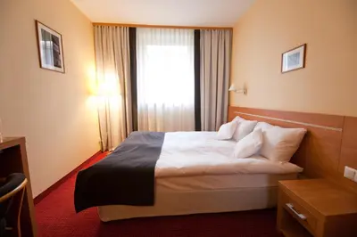 Łóżko lub łóżka w pokoju w obiekcie Hotel Malinowski Business
