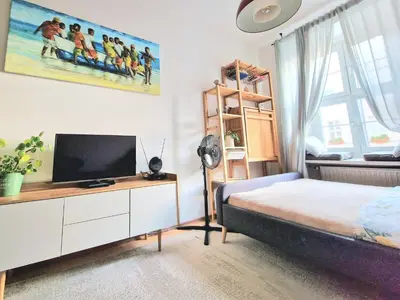 Łóżko lub łóżka w pokoju w obiekcie INNY Apartament Rynek Opole