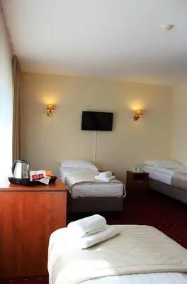 Łóżko lub łóżka w pokoju w obiekcie Hotel Biały