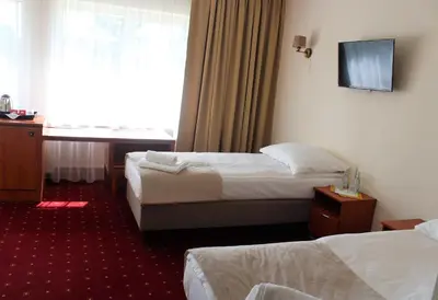Łóżko lub łóżka w pokoju w obiekcie Hotel Biały