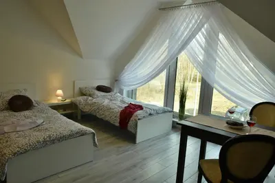Łóżko lub łóżka w pokoju w obiekcie Apartamenty Akacjowa Villa106