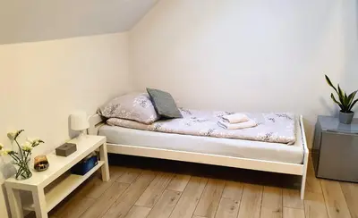 Łóżko lub łóżka w pokoju w obiekcie Apartamenty Akacjowa Villa106