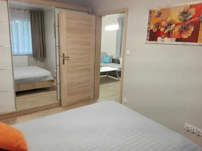 Łóżko lub łóżka w pokoju w obiekcie Apartamet Marzenie 7 - Opole
