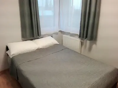 Łóżko lub łóżka w pokoju w obiekcie Apartamet Marzenie 7 - Opole