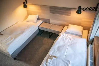 Łóżko lub łóżka w pokoju w obiekcie Krotoszyńska 28