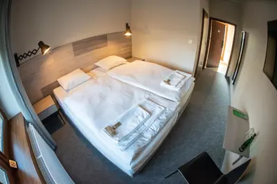 Łóżko lub łóżka w pokoju w obiekcie Krotoszyńska 28