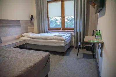 Łóżko lub łóżka w pokoju w obiekcie Krotoszyńska 28