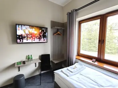 Łóżko lub łóżka w pokoju w obiekcie Krotoszyńska 28