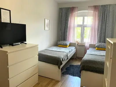 Łóżko lub łóżka w pokoju w obiekcie Lemuria Hostel Szkolna centrum