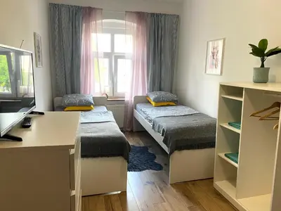 Łóżko lub łóżka w pokoju w obiekcie Lemuria Hostel Szkolna centrum