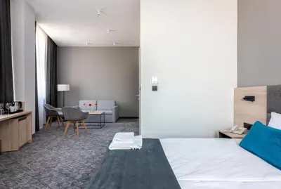 Łóżko lub łóżka w pokoju w obiekcie Korona Gold - Korona Hotel Wrocław